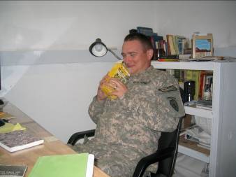 Sgt. Neal enjoying the smell of his lemon cookies! Thank you Girl Scouts!