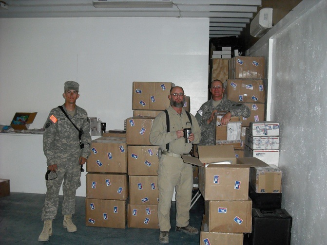 Ch Morken, Robert, and Ch Jacobs prepping boxes to go out to the smaller FOBs.