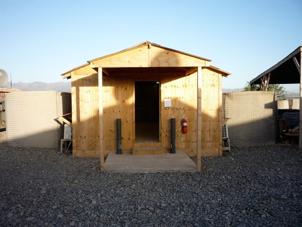 The chapel at Lilley. Notice the empty missile casings serving as "candle stands" outside the door!