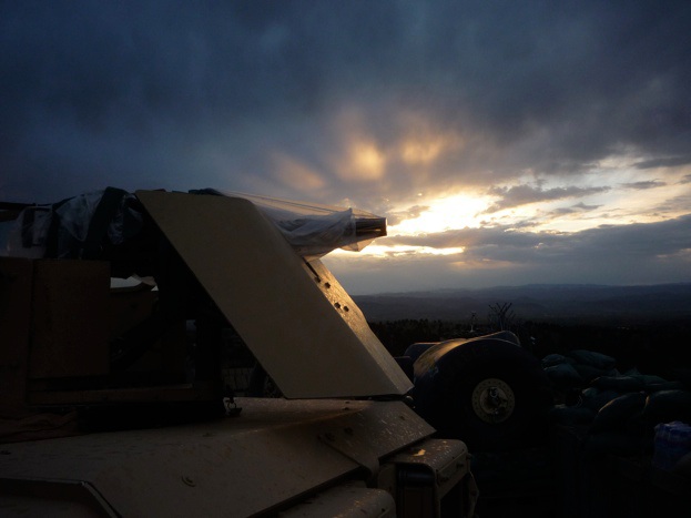 Sunset at MAL, with a gun-truck in the foreground.