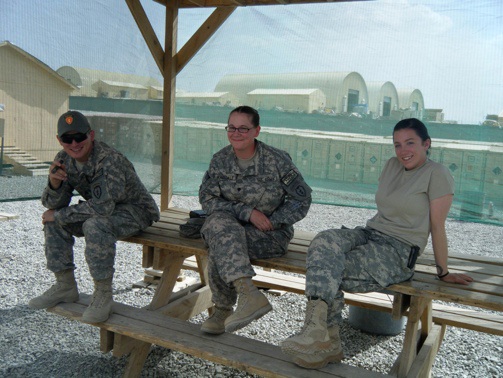Yes Kelly, your husband is smoking a cigar with two women. But he was with the chaplain at the time, so itʼs all good. Right?