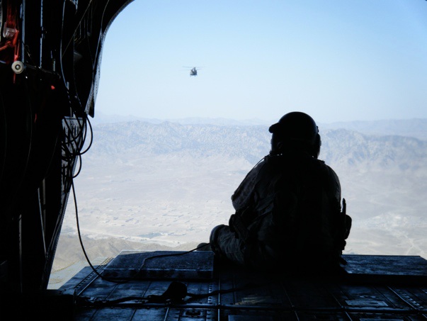 The rear gunner hanging out. You can see a second Chinook following us.